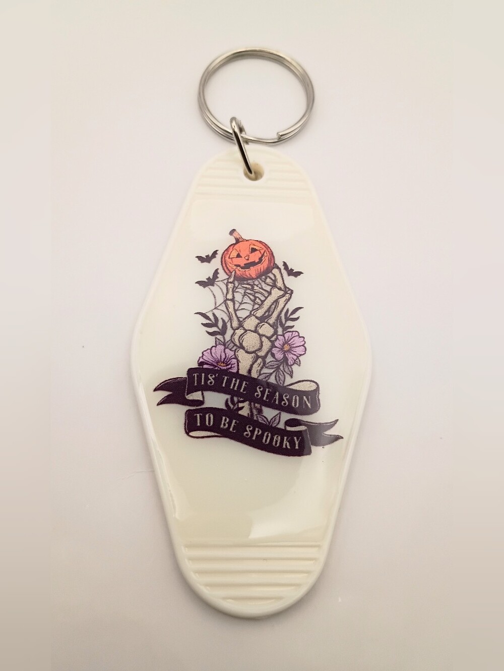 Source Unknown White Pumpkin Skeleton Keychain with Purple Accents